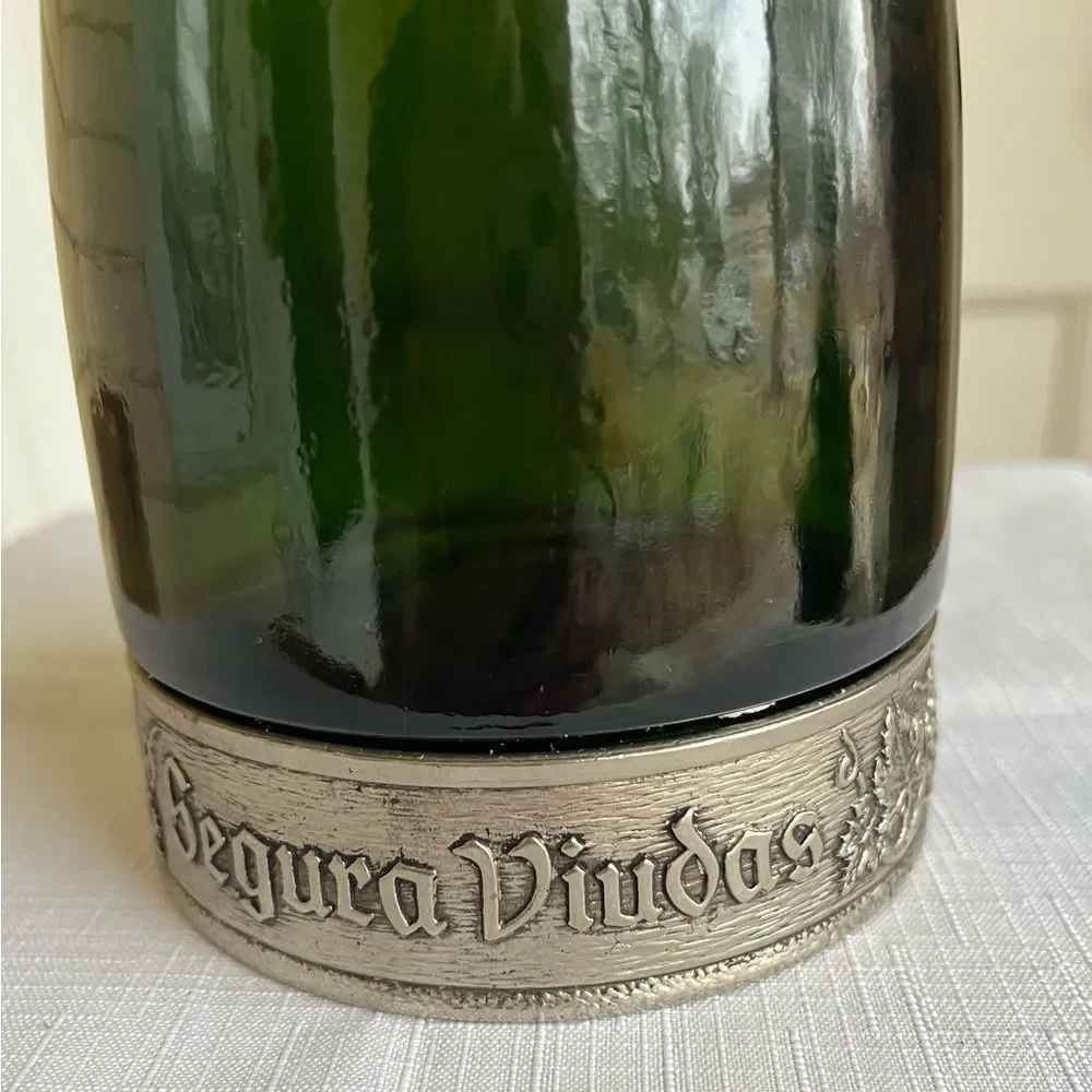 Vintage Segura Viudas glass dark green empty vine bottle with lid, Pewter decor.